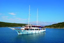 The motor yacht Harmonia, ready to take on clients for their island-to-island bike tours.
