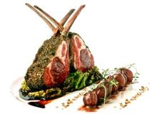 Roast Rack of Spring Lamb in Black Olive Crust on Garden Pea Mash with Red Wine Glazed Shallots and Natural Jus