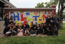 Hilton Pattaya’s team while painting the HHN wall with kids