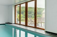 Coombe Farm, a luxurious converted barn, which comes with its own pool, cinema and wraparound garden, all set within 28 acres of