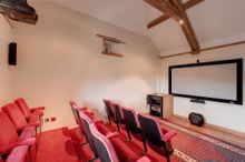 Coombe Farm's twelve seat cinema with projector and surround sound