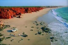 Driving Along The White Sands And Red Cliffs Of Cape Leveque