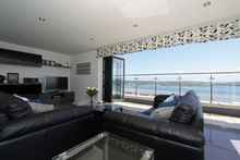 With 90 square metres of estuary facing terrace and breath-taking panoramic views across to Rock, The Penthouse at Padstow is an