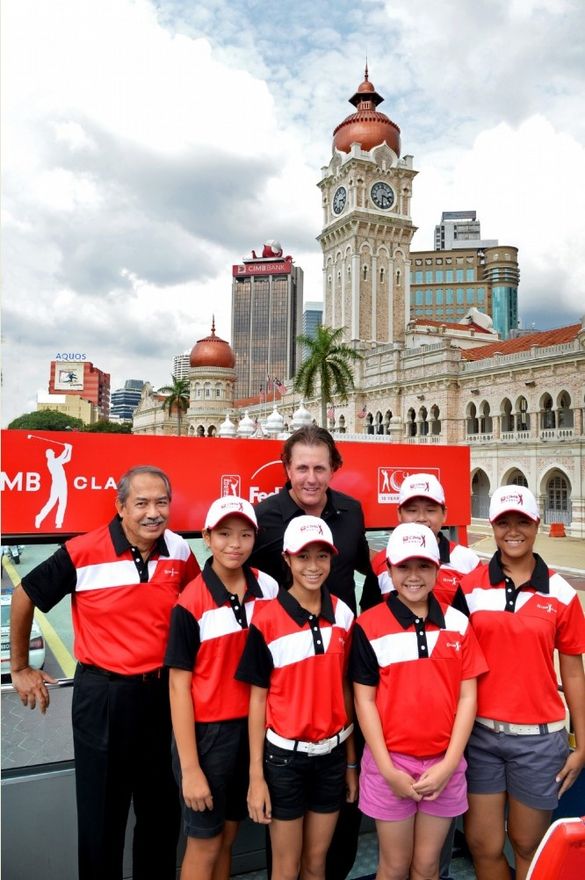 Phil Mickelson visiting Kuala Lumpur with juniors from the CIMB Development Programme and CIMB chairman Tan Sri Md Nor Yusof dur