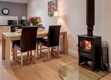 As Well As A Good-Size Dining Table For Four, The Lodge Has A Modern Oak Kitchen With Granite Worktops, An Electric Oven With Gr