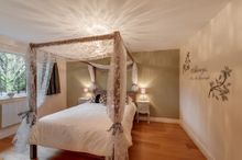 Overlooking The Lake, The Master Bedroom Offers A Touch Of Indulgence, With A King-Size Four-Poster Bed Draped In Lacy Floral Fa