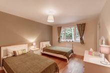 The Spacious Second Bedroom Overlooks Woodland And Is Furnished With Comfy Twin Beds.  It Too Has An Integrated Wardrobe, A Ches