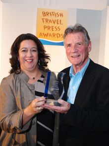 Michael Palin CBE receives his Outstanding Contribution award from Nim Singh at the Canadian Tourism Commission