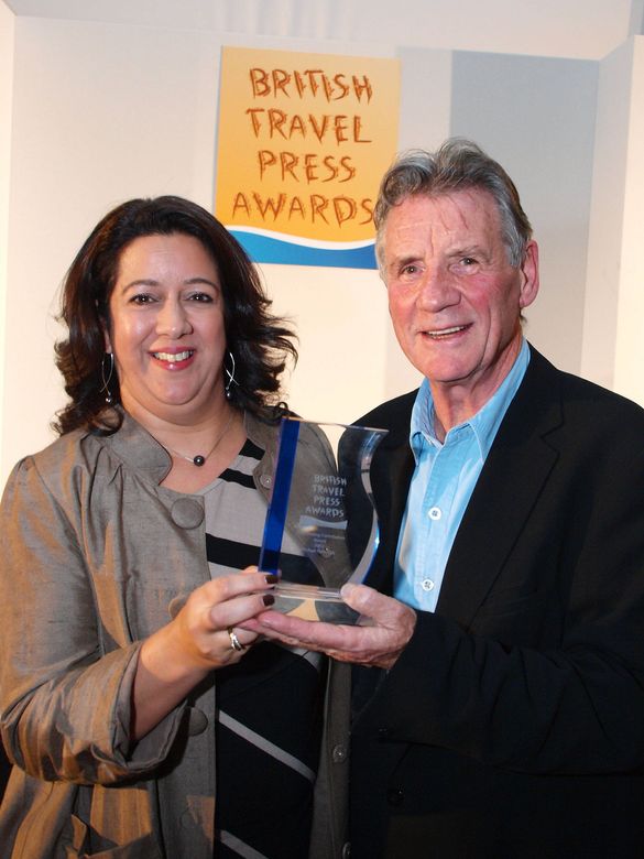 Michael Palin CBE receives his Outstanding Contribution award from Nim Singh at the Canadian Tourism Commission
