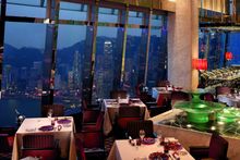Restaurant with evening view of city and harbor