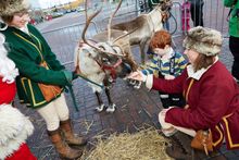 Tommy with the real reindeer and Santa at Snozone