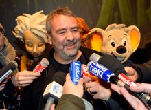 Star director Luc Besson being interviewed by international journalists