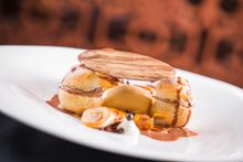 Profiteroles with chocolate cream and caramelized banana, honey comb and toffee ice cream  (only for Christmas Eve and Christmas
