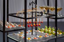 Fashion Plate resembles a couturier studio with trendy finger food including spicy lollipops clipped to wardrobe hangers