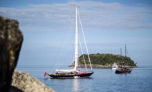 three of the attending Superyachts prepare for the day’s events in front of Kata Rocks, with a view to the island of Khu Phu