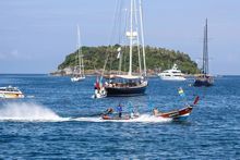 Longtail, Superyachts and the island of Kho Phu from Kata Rocks