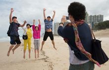 Chinese family on Surfers Paradise Beach, Queensland Australia Tourism and Events Queensland