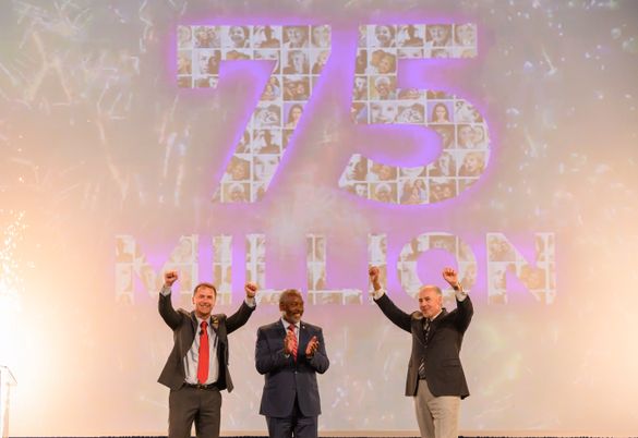 (Left to right) Adrian Jones, Visit Orlando Board Chair and Divisional Director USA, Merlin Entertainments USA Inc.; Orange County Mayor Jerry L. Demings; and George Aguel, President and CEO, Visit Orlando; celebrate a record 75 million visitors to Orland