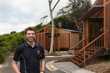 Executive Manager Capital Works Jack Plimmer enjoying the new villa precinct at Reflections Holiday Parks Clarkes Beach