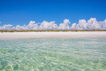 The beautiful white sand in the Heart of Florida's Emerald Coast remains cool to the touch, even in the heat of summer, and gives the water its trademark emerald color by reflecting sunlight back up through the surf.