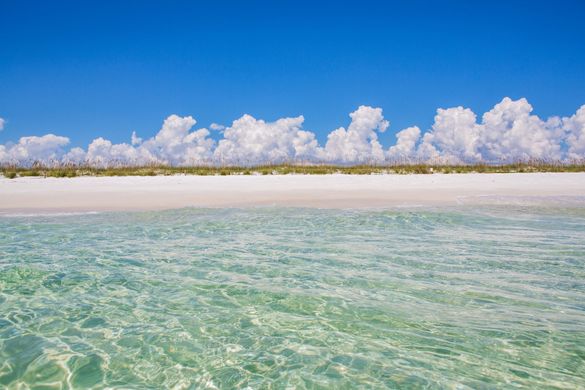 The beautiful white sand in the Heart of Florida's Emerald Coast remains cool to the touch, even in the heat of summer, and gives the water its trademark emerald color by reflecting sunlight back up through the surf.
