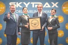 Photo caption: (Left) Alexandr Neboga, Vice-President, Ground Services, Air Astana and (center) Peter Foster, President and CEO, Air Astana with Air Astana team.