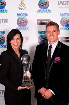 Oonagh McCullagh with Florida's Paradise Coast receives the 2014 Golf Destination of the Year Award from IAGTO's Giles Greenwood