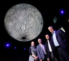 Canberra Moon Rock Trail Questacon’s Stephanie Hodge, NMA’s Robert Bunzli, Geoscience Australia’s Steve Petkovski and Dr Ed Kruzins, Director of the Canberra Deep Space Communication Complex stand under the giant moon in Questacon’s The Moon exhibit galle