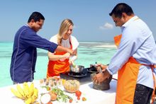 Guests enjoying a Vegan Cooking Class at Mirihi Island Resort.