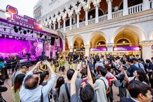 Revellers in the lagoon area of The Venetian Macao Thursday enjoy the festivities of the Macau Wine and Dine Festival 2014 on th
