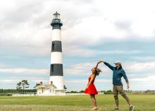 The savings available on an Outer Banks getaway this time of year will have you dancing! Try climbing the Bodie Island Lighthouse, one of three you can ascend on the OBX this summer! courtesy OuterBanks.org