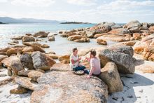 Eating seafood on the beach in Bicheno Tasmania