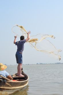 MYANMAR: Learning how to cast a fishing net on the Ayeyarwady River