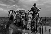 Time to Act exhibition -- One of 30 photographs by Kevin Frayer in the exhibition