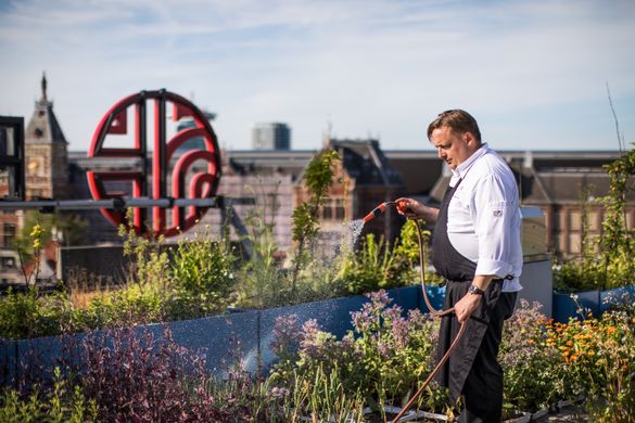 NH Hotel Group chef Chris Naylor, who holds one Michelin star, tending to the rooftop vegetable garden of NH Collection Amsterdam Barbizon Palace