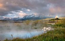 Late September snow in the Sawtooths calls for an early morning soak at Snakepit Hot Springs.