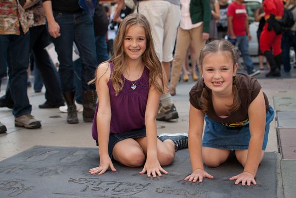 Famous handprints and footprints at Hollywood's TCL Chinese Theater is a visitor favorite on CitySightseeing's Hop-On Hop-Off Re