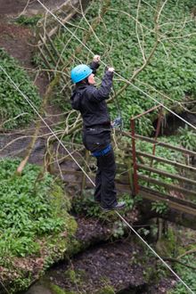 Adrenaline seekers on the Postman's Walk - one of three new aerial walkways on How Stean Gorge's via ferrata