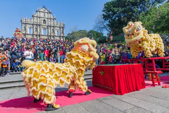 Lion dancing at the steps to Macao's iconic Ruins of St Paul's