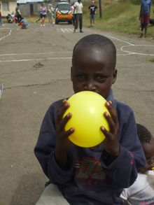 Volunteers visit a community project. 
