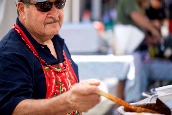 A man serves up some piping hot chili at the 2013 Chili on the Comstock event in Virginia City, Nev.