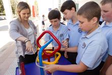 Canberra students enjoy Questacon portable science exhibits that will travel to Japan