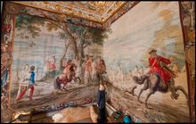 Blenheim Palace's Kate Ballenger inspects the newly restored tapestry