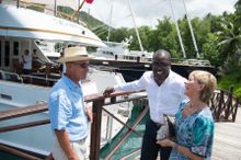Marina Manager Troy Blanchard (centre) meets with marina guest