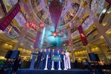 Dr. Wilfred Wong, President of Sands China Ltd. (third right) and Ricky Hoi, Acting Director of the Macao Government Tourism Office (centre), along with Sands China Ltd. senior executives, unveiled a stunning 50-foot inverted Christmas tree at The Parisia