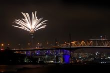 The Auckland Harbour Bridge and the Sky Tower light up New Year's Eve 2018