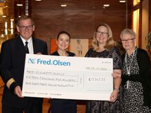 Hotel Manager Michael Prantz, PR Executive Ellis Barker and Travel Trunk artist Angela Ashford (far right) present a cheque to Judi Newman, Development Director at St Elizabeth Hospice