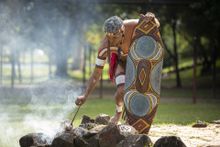 Experience a fire making ceremony at Tjapukai Aboriginal Cultural Park.