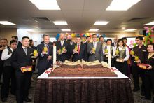 Sands China executives celebrate Sands Cotai Central’s second anniversary with company team members, including some who were bor
