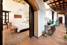 A luxury guestroom in Casa del Arbol offering unparalleled intimacy and access to a private Spanish courtyard.